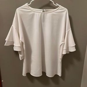 White blouse with ruffled sleeves